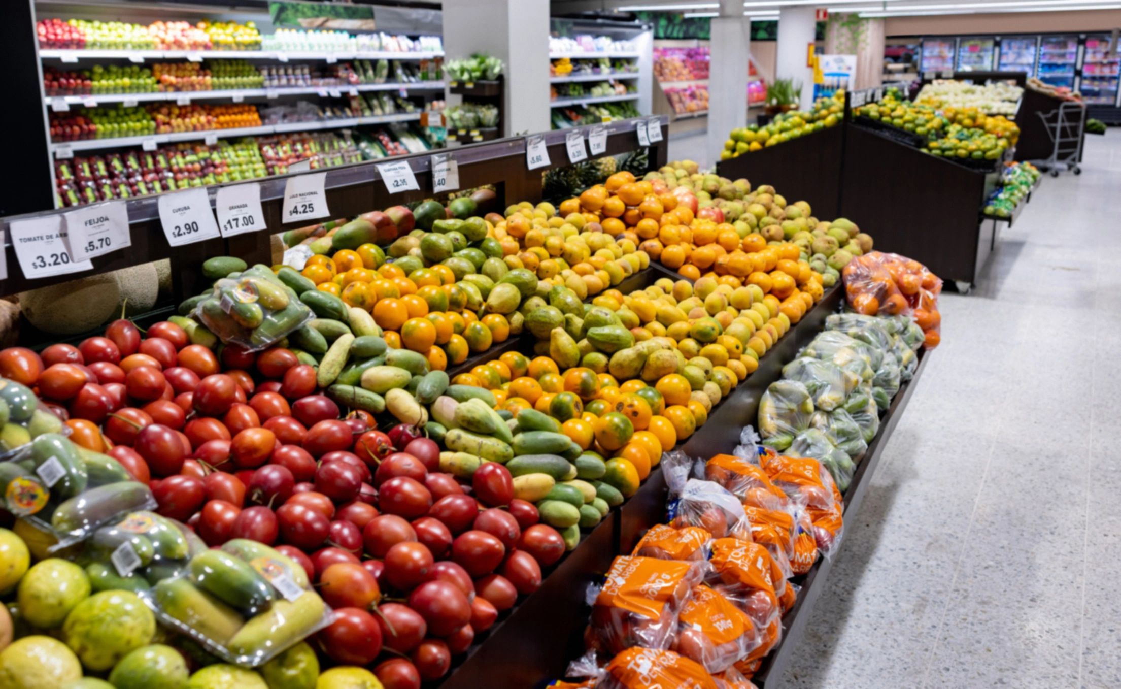 Wide view of a grocery produce aisle